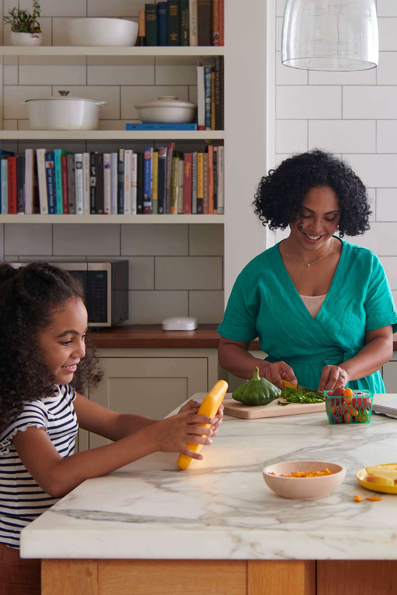 Family in kitchen on tablet