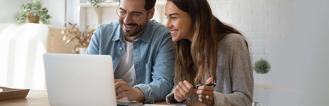 Smiling young couple makes an account name change